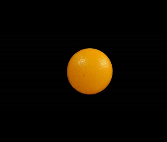 Dieses Bild zeigt eine orange Pille.