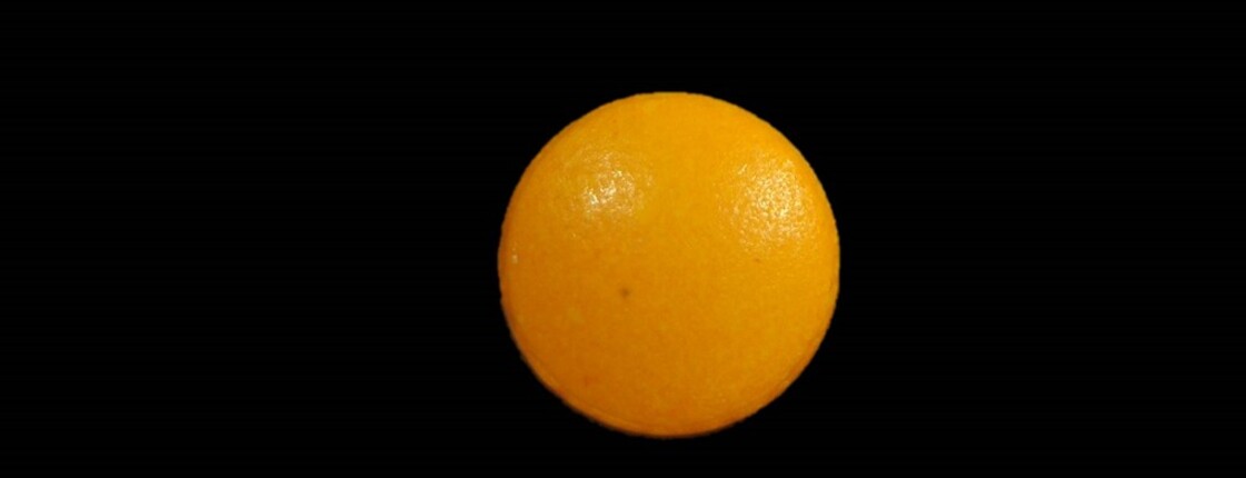 Dieses Bild zeigt eine orange Pille.