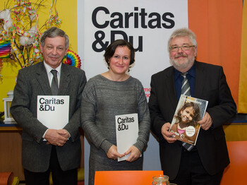 Der Direktor der Caritas St. Pölten und zwei weitere MItarbeiter bei Kinderkampagne